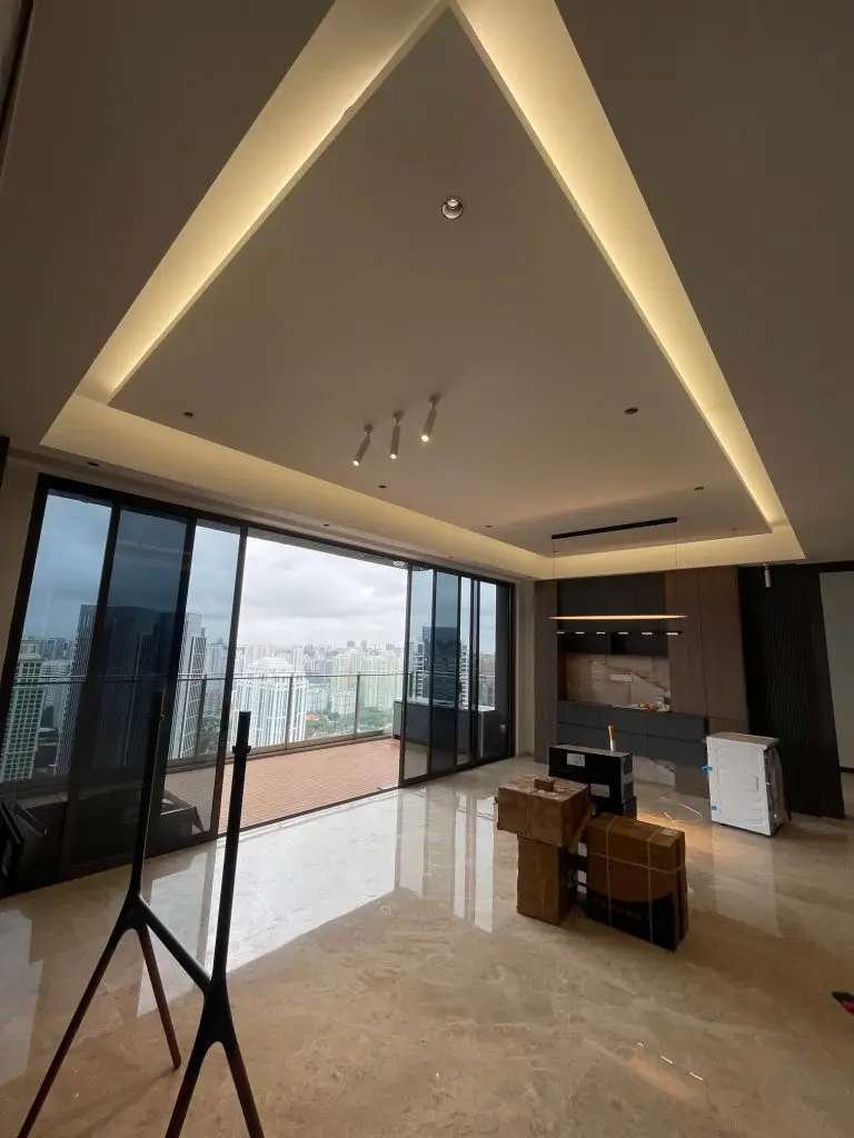 The Avenir penthouse living room with island false ceiling and concealed cove lighting